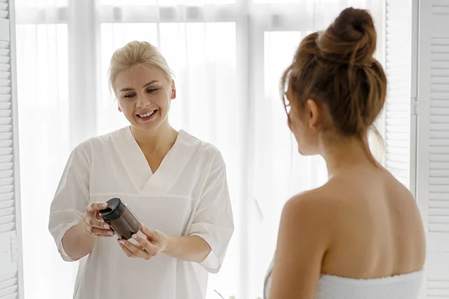 Beautician discussing skincare products with a client
